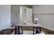 Bright office space with a modern desk and a view into another room, providing a functional work-from-home setup at 31932 Steven Way, Conifer, CO 80433