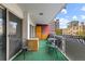 A cozy balcony with chairs, a table, and an outdoor storage cabinet at 1121 Albion St # 305, Denver, CO 80220