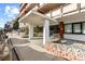 Apartment entrance featuring a covered walkway, landscaping, and benches for residents at 1121 Albion St # 305, Denver, CO 80220