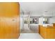 Open-concept living area with neutral tones, large windows and private balcony access at 1121 Albion St # 305, Denver, CO 80220