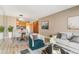 A cozy living room featuring a dining table, comfortable sofa, and natural light at 1121 Albion St # 305, Denver, CO 80220