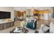 Stylish living room with wood floors, comfortable seating, and a modern entertainment center at 1121 Albion St # 305, Denver, CO 80220