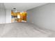 Open-concept space showcasing the living area and adjacent kitchen at 1121 Albion St # 305, Denver, CO 80220