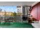 Private outdoor patio with seating area and views of the surrounding neighborhood at 1121 Albion St # 305, Denver, CO 80220