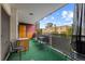 Private outdoor patio with seating area and views of the surrounding neighborhood at 1121 Albion St # 305, Denver, CO 80220