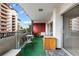 Private outdoor patio with seating area and views of the surrounding neighborhood at 1121 Albion St # 305, Denver, CO 80220