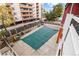 Apartment complex pool area with cover, surrounded by an apartment building and landscaping at 1121 Albion St # 305, Denver, CO 80220