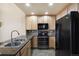 Stylish kitchen with granite countertops and stainless steel appliances at 16149 E Geddes Ln # 99, Aurora, CO 80016