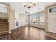 Bright living room featuring hardwood floors, a fireplace, and large windows at 16149 E Geddes Ln # 99, Aurora, CO 80016