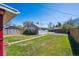 Spacious backyard with a shed, green lawn, and wood fence at 1716 Fulton St, Aurora, CO 80010