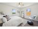 Bright bedroom with white walls, two windows, and modern decor at 1716 Fulton St, Aurora, CO 80010