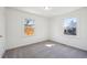 Clean, simple bedroom with neutral carpet and plenty of natural light at 1716 Fulton St, Aurora, CO 80010