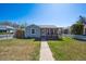 Inviting single-Gathering home features a cozy front porch and a well-manicured lawn at 1716 Fulton St, Aurora, CO 80010