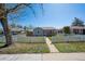 Charming single-story home with a white picket fence and well-maintained front yard at 1716 Fulton St, Aurora, CO 80010