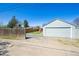 Detached garage with a long driveway leading up to it at 1716 Fulton St, Aurora, CO 80010