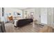 Comfortable living space with modern decor, wood flooring, and stylish furnishings and great natural light at 1716 Fulton St, Aurora, CO 80010