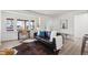 Bright living room features a large window, wood floors, stylish decor and comfortable seating at 1716 Fulton St, Aurora, CO 80010