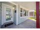 Charming front porch with a welcoming entrance, a glass storm door, and great curb appeal at 1716 Fulton St, Aurora, CO 80010