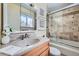 Bathroom with stone tile shower, frameless glass, and modern fixtures, vanity, and lighting at 4707 Ashfield Ct, Boulder, CO 80301