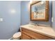 A stylish bathroom with a classic mirror and a sink with a wooden cabinet base at 4707 Ashfield Ct, Boulder, CO 80301