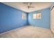 Bedroom with carpeted floors, two large windows with lots of light, and bright blue walls at 4707 Ashfield Ct, Boulder, CO 80301