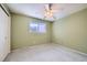 This bedroom boasts a ceiling fan for added comfort and a window that let in natural light at 4707 Ashfield Ct, Boulder, CO 80301