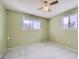 This bedroom boasts a ceiling fan for added comfort and dual windows that let in natural light at 4707 Ashfield Ct, Boulder, CO 80301