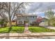 Charming blue two-story home with well-maintained front yard and mature tree at 4707 Ashfield Ct, Boulder, CO 80301