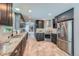 Modern kitchen with granite countertops, stainless steel appliances, and gray cabinetry at 4707 Ashfield Ct, Boulder, CO 80301