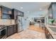 Modern kitchen with granite countertops, stainless steel appliances, and open concept to living room at 4707 Ashfield Ct, Boulder, CO 80301