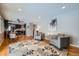 Open floor plan living room with hardwood floors and modern furniture at 4707 Ashfield Ct, Boulder, CO 80301