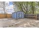 Backyard storage shed on a concrete pad with double doors and a fully fenced yard at 4707 Ashfield Ct, Boulder, CO 80301