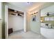 Spacious walk-in closet with custom shelves, overhead lighting, and easy access to Primary suite at 4707 Ashfield Ct, Boulder, CO 80301
