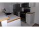 Bright kitchen featuring stainless steel appliances, white cabinets, and a convenient layout at 6705 S Field St # 802, Littleton, CO 80128