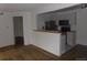 Bright kitchen featuring stainless steel appliances and a convenient breakfast bar for casual dining at 6705 S Field St # 802, Littleton, CO 80128