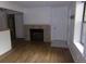 Cozy living room featuring hardwood floors and a stylish fireplace, creating a warm and inviting atmosphere at 6705 S Field St # 802, Littleton, CO 80128