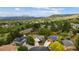 Aerial shot of homes with solar panels, showcasing the neighborhood and scenic landscape at 13249 W Jewell Pl, Denver, CO 80228