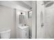 Clean bathroom features a modern vanity, updated fixtures, and tiled walk-in shower at 13249 W Jewell Pl, Denver, CO 80228