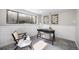 Bright home office with large windows, modern desk, and comfortable seating at 13249 W Jewell Pl, Denver, CO 80228