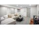 Inviting living room with stylish decor, plush sectional, and ample space at 13249 W Jewell Pl, Denver, CO 80228