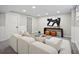 Cozy living room featuring plush seating, modern decor, and recessed lighting at 13249 W Jewell Pl, Denver, CO 80228