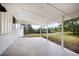 Covered patio offering serene views of the expansive backyard and surroundings at 13249 W Jewell Pl, Denver, CO 80228
