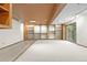 Spacious basement area with built-in shelves and a slider to the exterior at 3900 Bogey Ct, Longmont, CO 80503