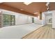 Finished basement with built-in shelving and sliding glass doors to the exterior at 3900 Bogey Ct, Longmont, CO 80503