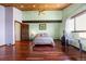 Bedroom featuring wood ceiling, hardwood floors, natural light and decorative touches at 3900 Bogey Ct, Longmont, CO 80503
