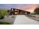Exterior view of a home featuring a spacious driveway and well-maintained landscape at 3900 Bogey Ct, Longmont, CO 80503