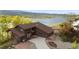 Exterior of a lovely home with well-maintained landscaping and mountain and lake views at 3900 Bogey Ct, Longmont, CO 80503