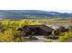Charming home with mountain and lake views nestled amidst vibrant green trees, offering a serene retreat at 3900 Bogey Ct, Longmont, CO 80503
