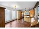 Bright kitchen boasts stainless appliances, wooden cabinets and tile floors at 3900 Bogey Ct, Longmont, CO 80503