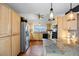 Well-equipped kitchen with stainless steel appliances and maple cabinets at 3900 Bogey Ct, Longmont, CO 80503
